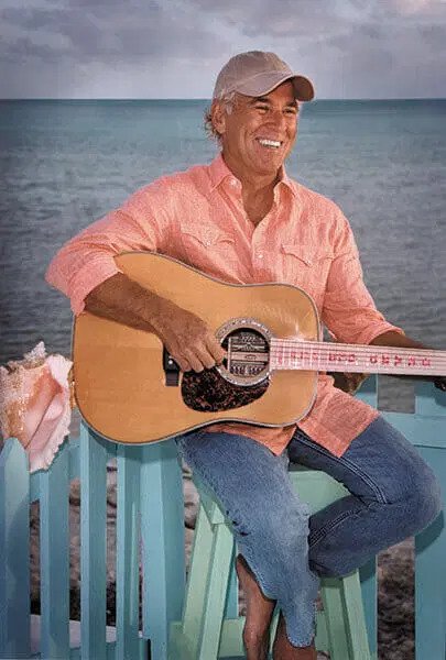 Jimmy Buffet playing guitar